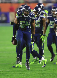 Feb 1, 2015; Glendale, AZ, USA; Seattle Seahawks middle linebacker Bobby Wagner (54) celebrates after his interception against the New England Patriots during the third quarter in Super Bowl XLIX at University of Phoenix Stadium. Mandatory Credit: Andrew Weber-USA TODAY Sports